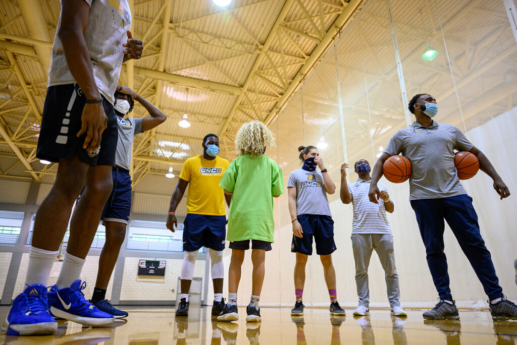 Basketball players and child