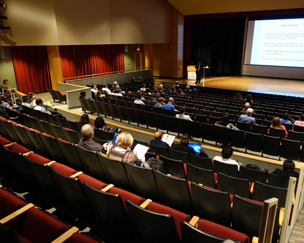 people sit in conference hall