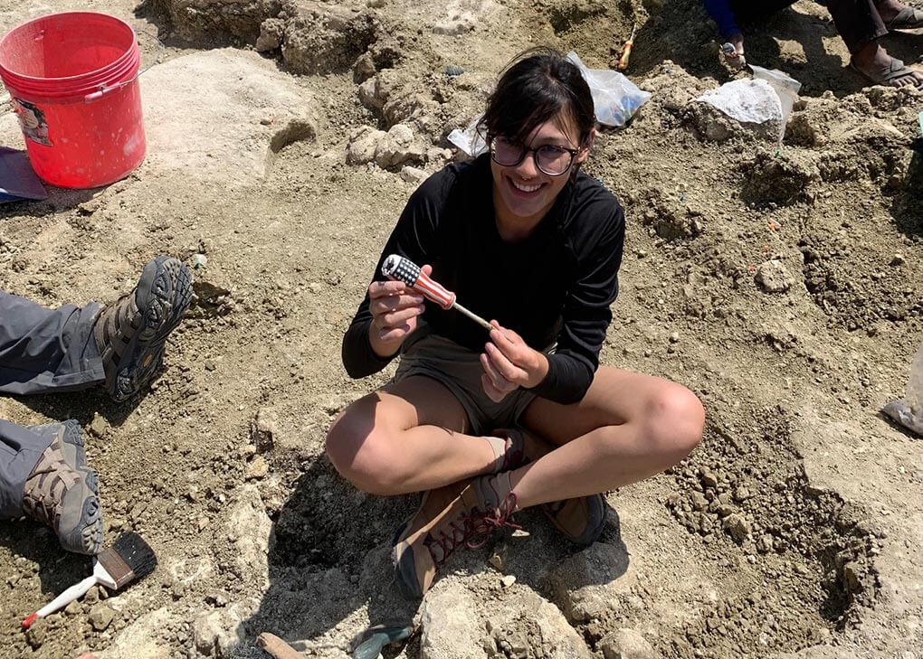 young woman at archaeological dig