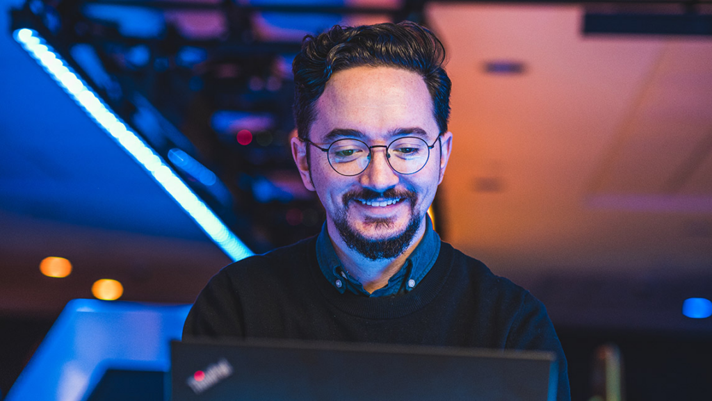 John Borchert types on computer