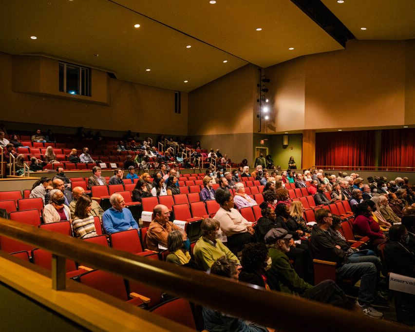 people seated in auditorium