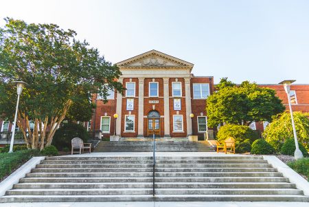 the curry building on UNCG campus, from below the large wide concrete staircases in front