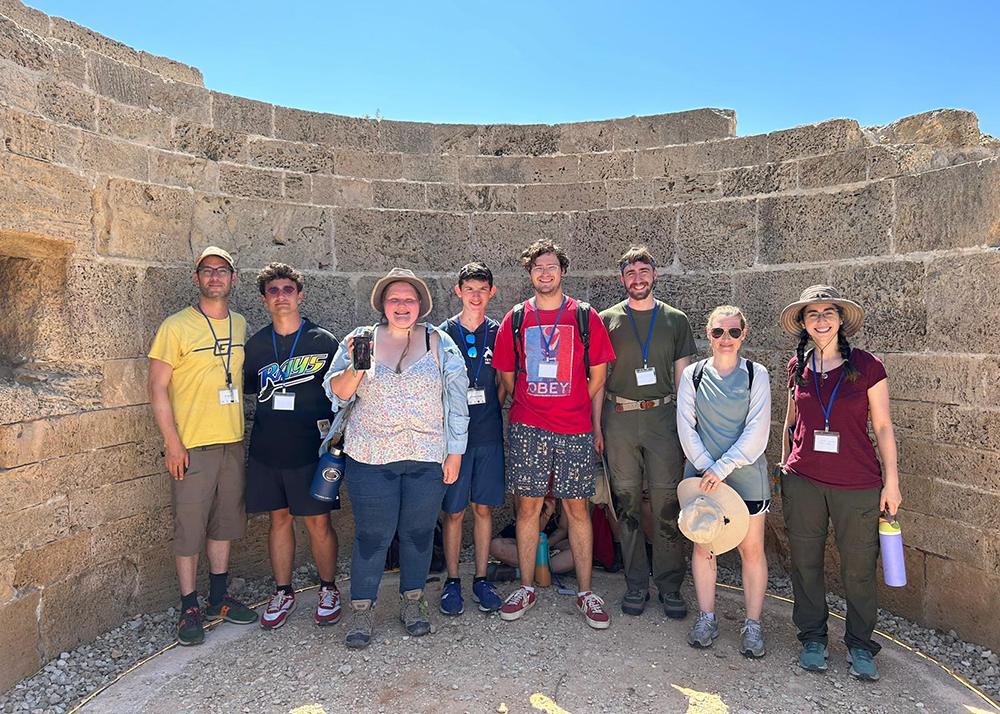 Group of students with professor Eger at ruins in Israel
