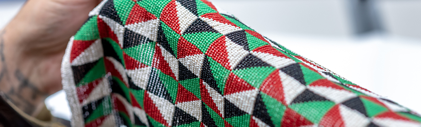 African tapestry in red, white, green, and black