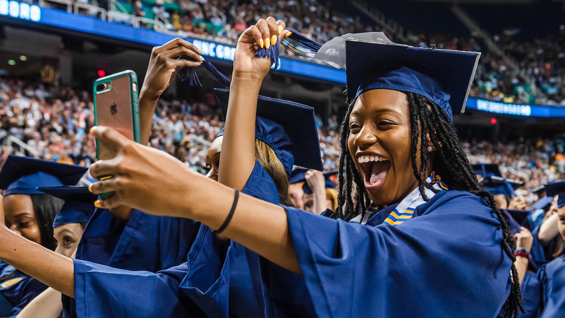 Student taking a selfie at graduation