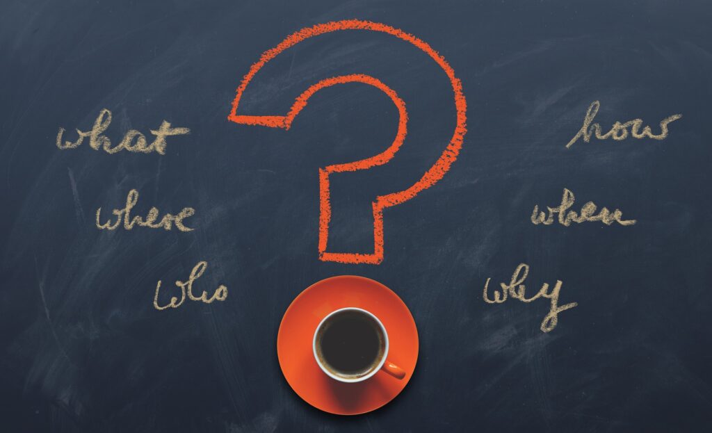 A stock image of an orange question mark with a cup of coffee as the point; accompanied by the 5 Ws, and "how"