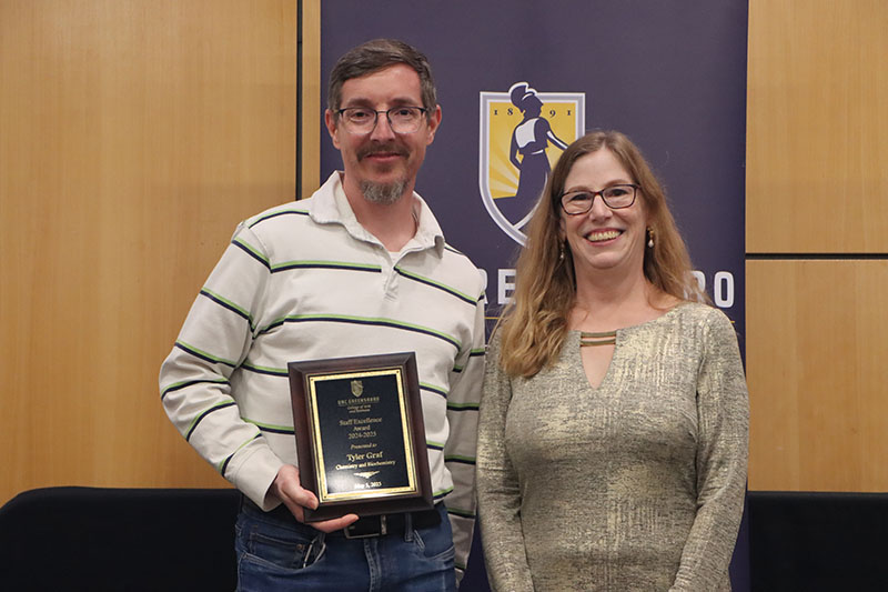 Tyler Graf, Staff Excellence Award Recipient, with Dean Adamson