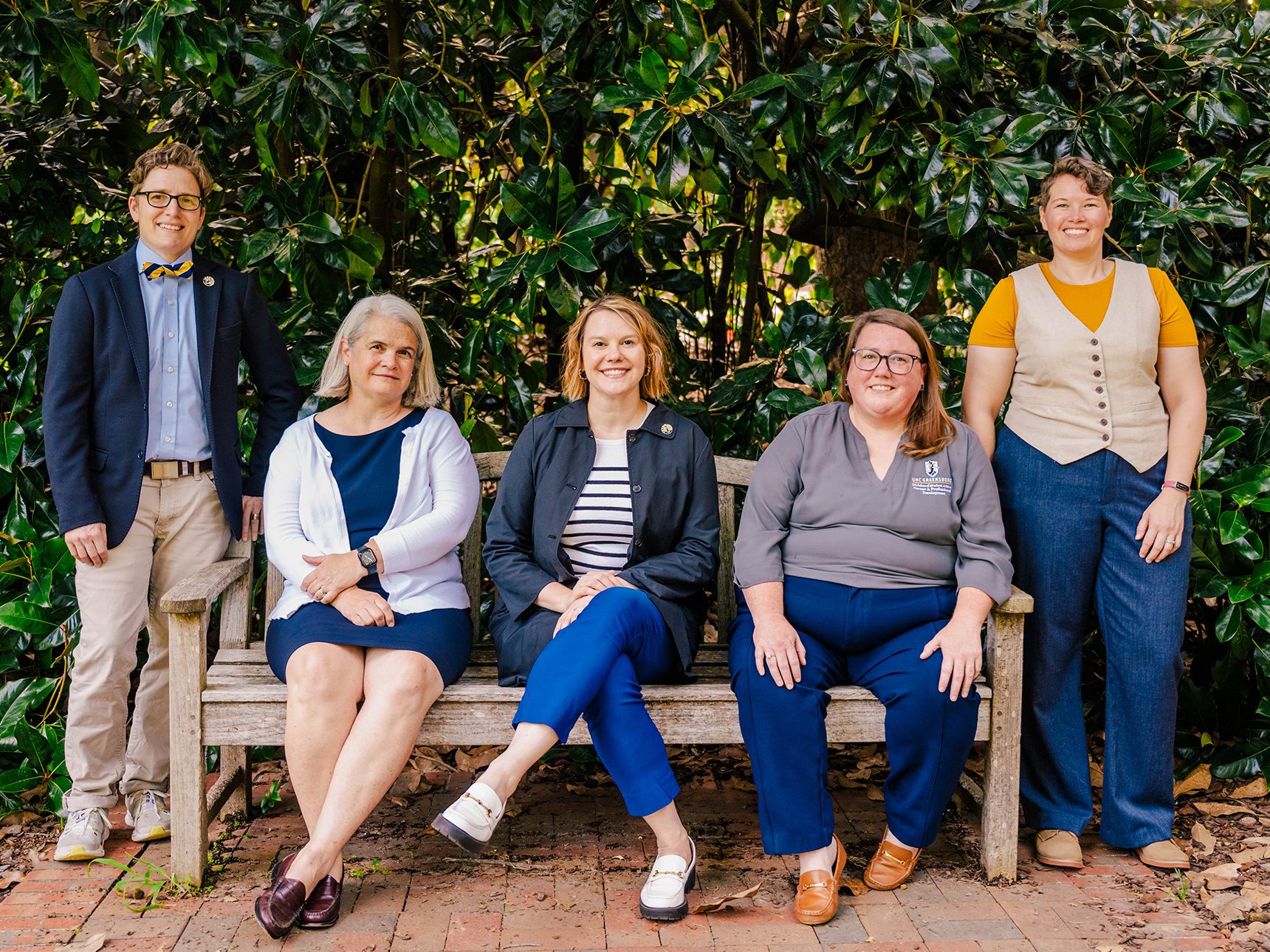 Humanities at Work team gathered at an outside bench