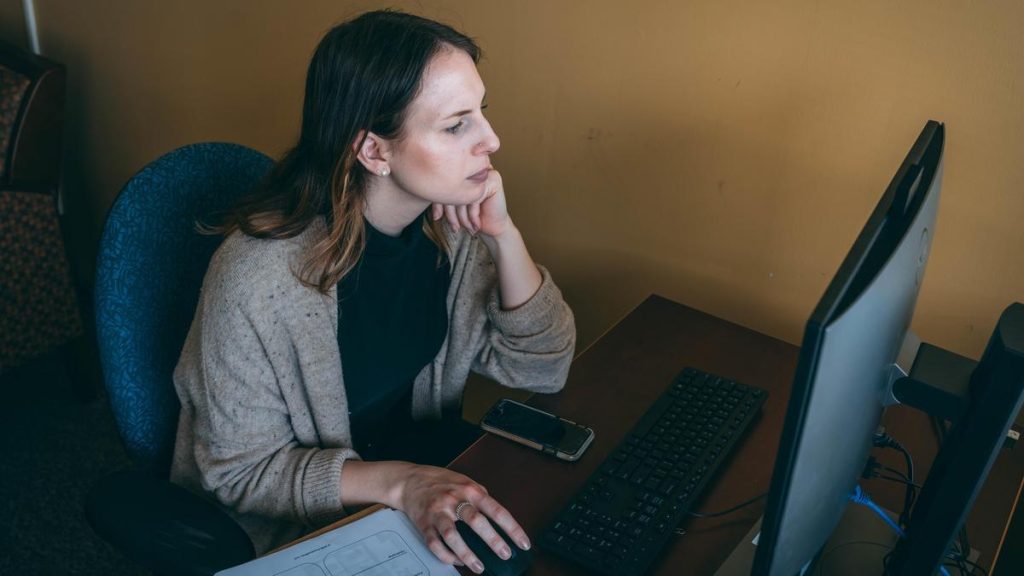 woman looking at computer screen