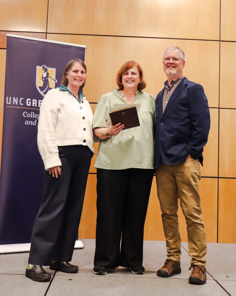 Dean Kelly Joyce (left) poses with Megan Corum (center) and Department Head Malcolm Schug