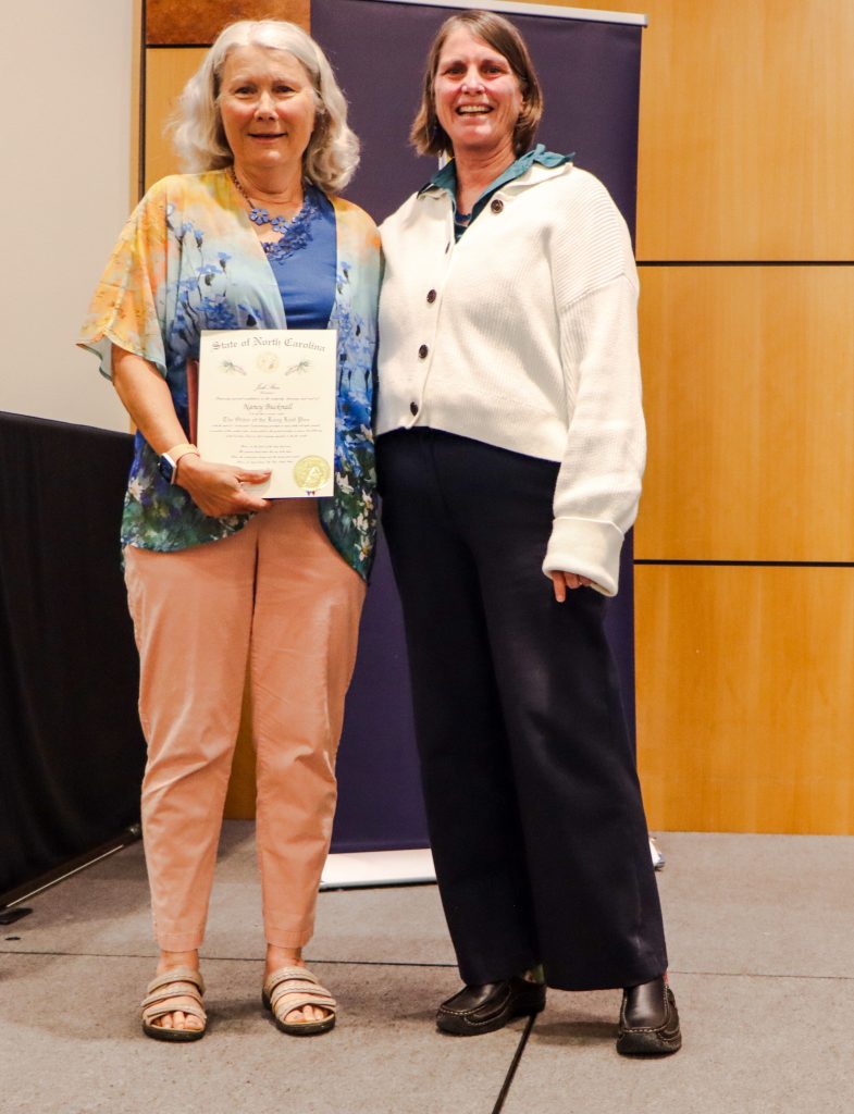 Dean Kelly Joyce (left) poses with Director of CASA Nancy Bucknall (center)