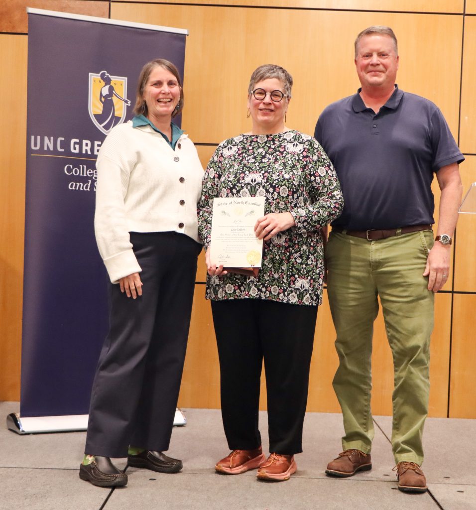 Dean Kelly Joyce (left) poses with Professor Lisa Tolbert (center) and Department Head Greg O'Brien (right)