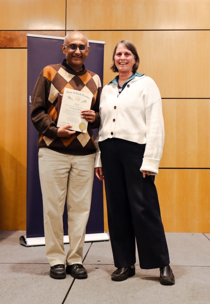 Dean Kelly Joyce (right) honored Department Head Promod Pratap (left)
