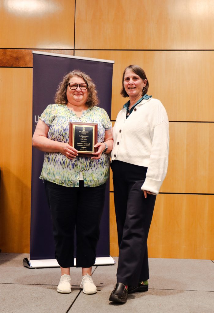 Dean Kelly Joyce (right) poses with Administrative Support Associate Denise Greenwell after honoring her with a College of Arts & Sciences Staff Excellence Award