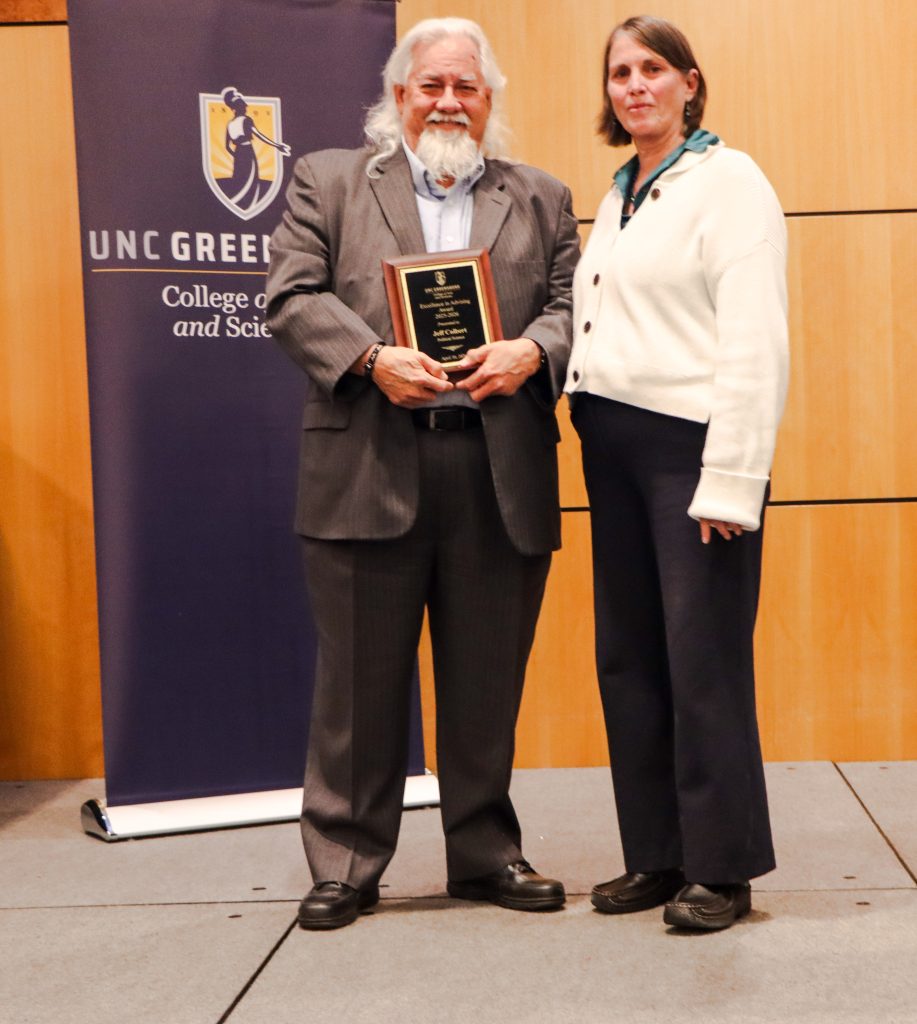 Dean Kelly Joyce (right) poses with Jeff Colbert after honoring him with a College of Arts & Sciences Advising Excellence Award