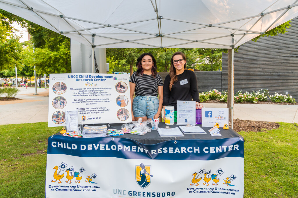 psychology students running an information table at an outdoor event