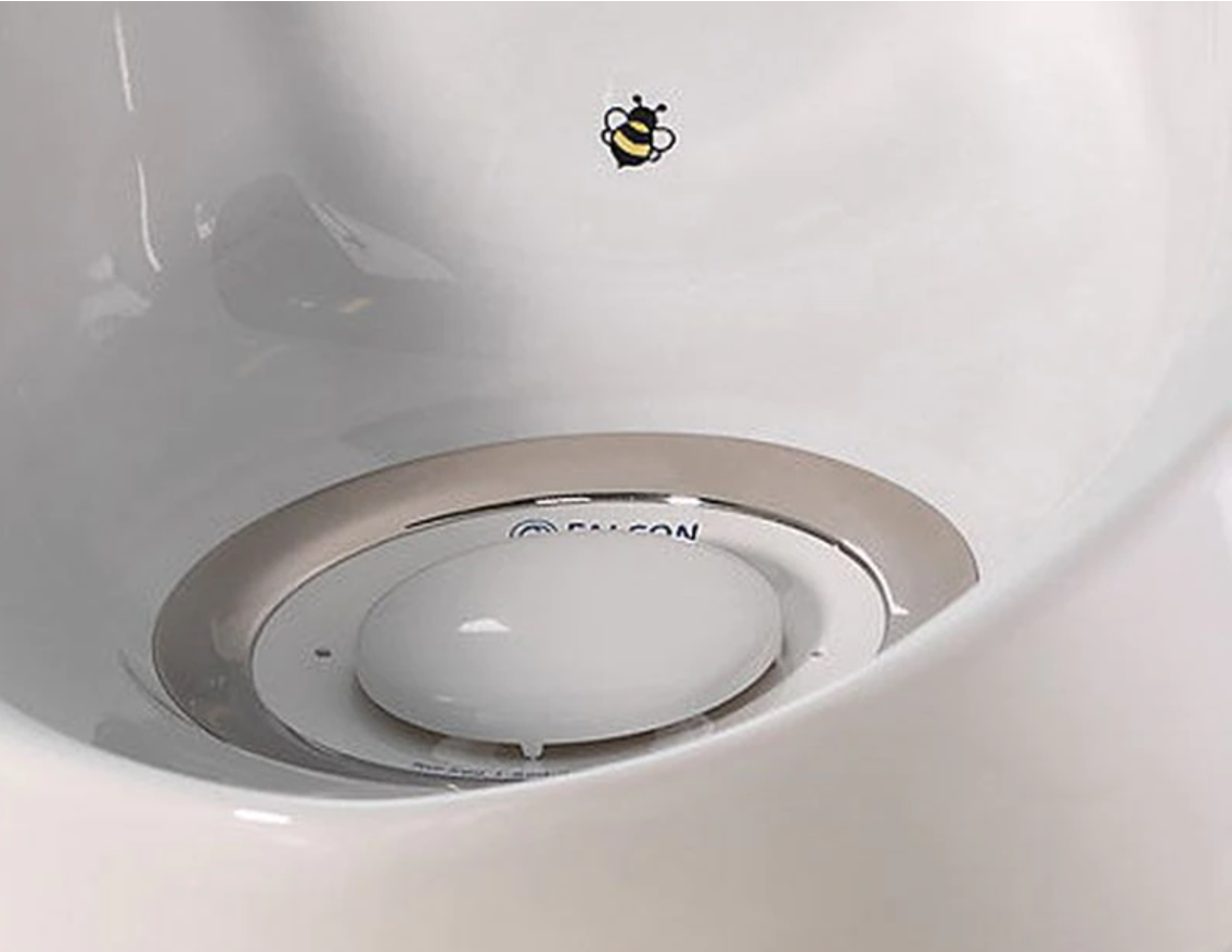 A target in a urinal encourages accurate use.