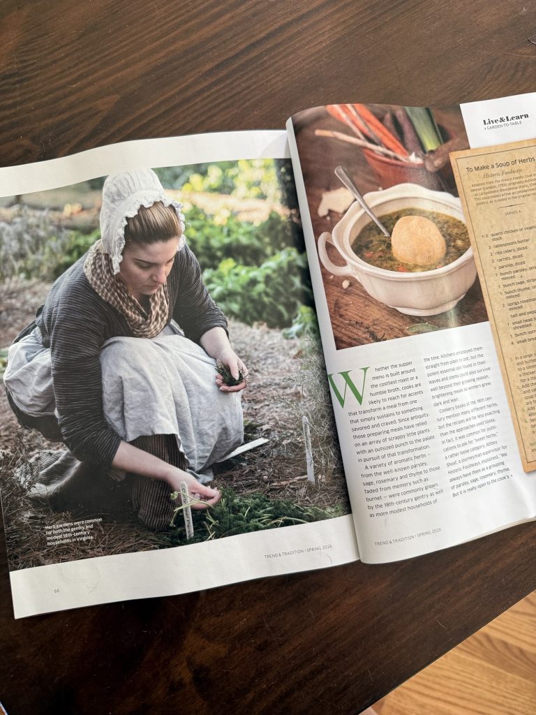 A photo of a magazine article. Shoaf is featured in a photo on the left page of the spread, in full 18th century costume.